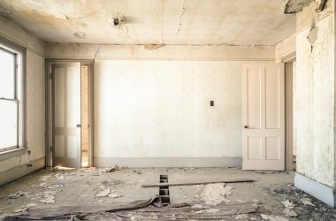 Photo by Nolan Issac gray concrete walls with broken floor